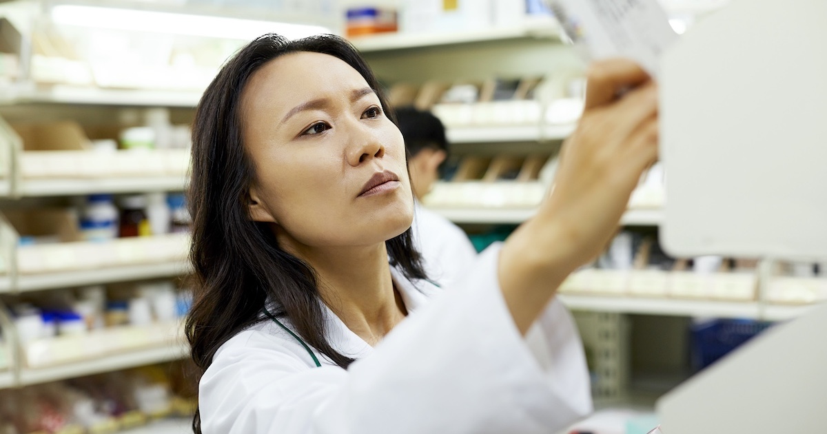 Pharmacist conducting inventory