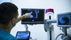 Imaging specialist reviewing a scan Imaging specialist reviewing a scan