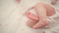 A baby in NICU bed