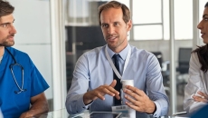 Clinician consulting with colleagues