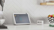 Amazon's air quality monitor next to an Alexa device displaying quality metrics Amazon's air quality monitor next to an Alexa device displaying quality metrics