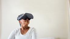 A woman wearing an AppliedVR headset A woman wearing an AppliedVR headset