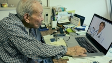Senior adult consulting with healthcare professional via laptop computer Senior adult consulting with healthcare professional via laptop computer
