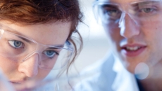 Two healthcare professionals wearing safety goggles Two healthcare professionals wearing safety goggles