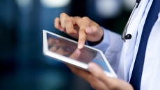 Healthcare provider on a tablet Healthcare provider on a tablet