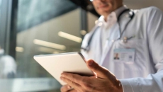 Doctor looking at tablet Doctor looking at tablet