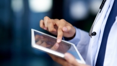 Healthcare provider using a tablet Healthcare provider using a tablet