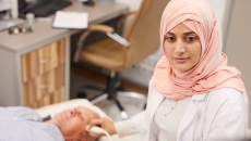 Technician performing an ultrasound exam Technician performing an ultrasound exam