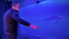 A man playing MindMaze's MindPod game. A man playing MindMaze's MindPod game.