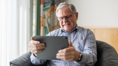 Patient interacting via tablet Patient interacting via tablet
