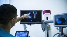 Radiologist reviewing mammogram results Radiologist reviewing mammogram results