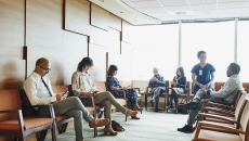 Patients sitting in a waiting room Patients sitting in a waiting room