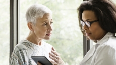 Healthcare professional consulting with a patient Healthcare professional consulting with a patient