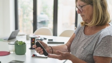 A person with diabetes checking her blood glucose. A person with diabetes checking her blood glucose.