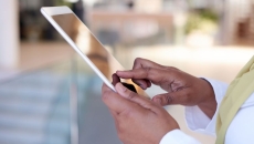 A close up version of a person using a tablet A close up version of a person using a tablet