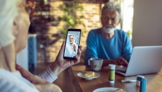 An older couple talking to a provider via telehealth An older couple talking to a provider via telehealth