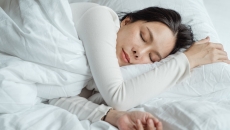 A person sleeping in bed A person sleeping in bed