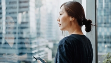 A person using a smartphone. A person using a smartphone.