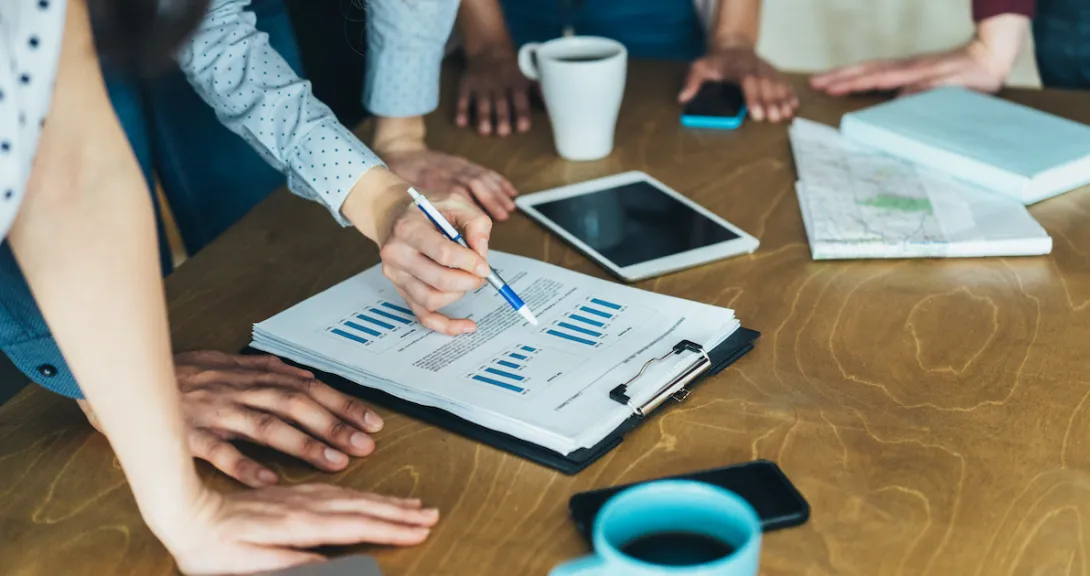 A group of businesspeople looking at financial charts