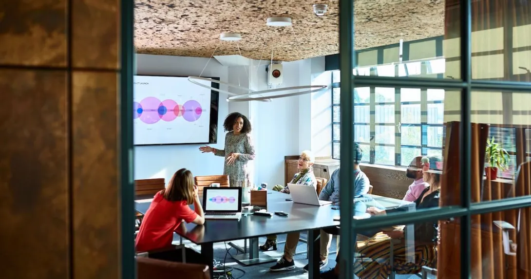A woman presenting to potential investors